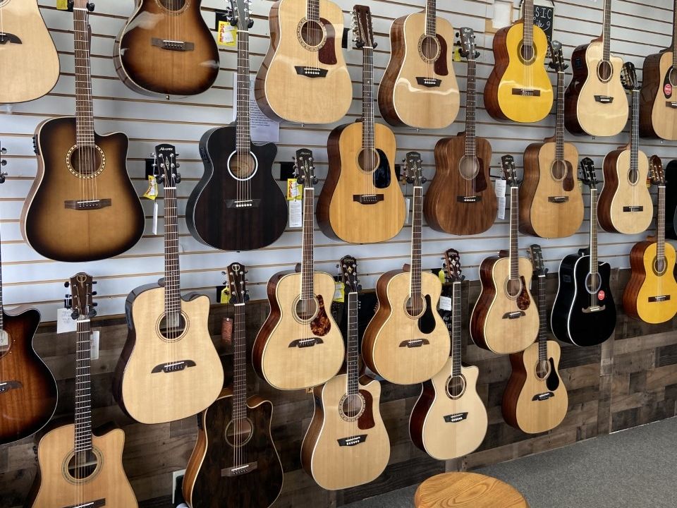 Angled view along the acoustic wall with amps lined up underneath