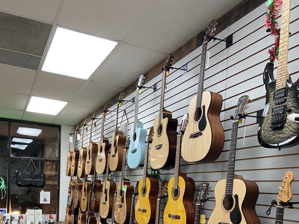 Acoustic wall seen from the door with the guitar rack running to the back